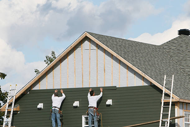Professional Emergency Siding Repair technician working in Bedford, MA